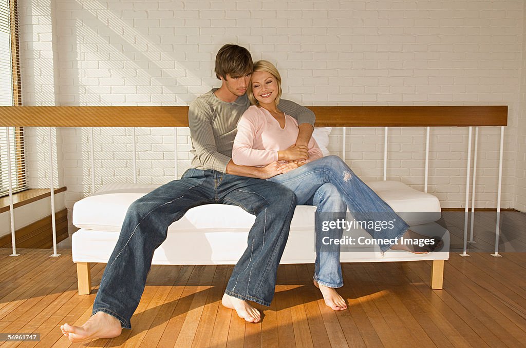 Couple relaxing on sofa