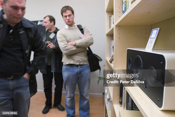 People look at the new iPod Hi-Fi speaker system designed for the iPod at a special Apple event February 28, 2006 in Cupertino, California. Along...