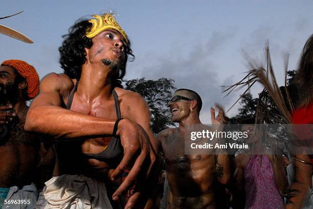 Travellers and backpackers dance at a carnival on the beach on Febraury 27, 2006 in Arambol, Goa, India. The tiny Indian state became known as a...
