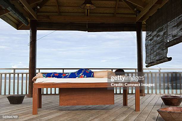 Woman Lying On Massage Table Side View Photos and Premium High Res ...