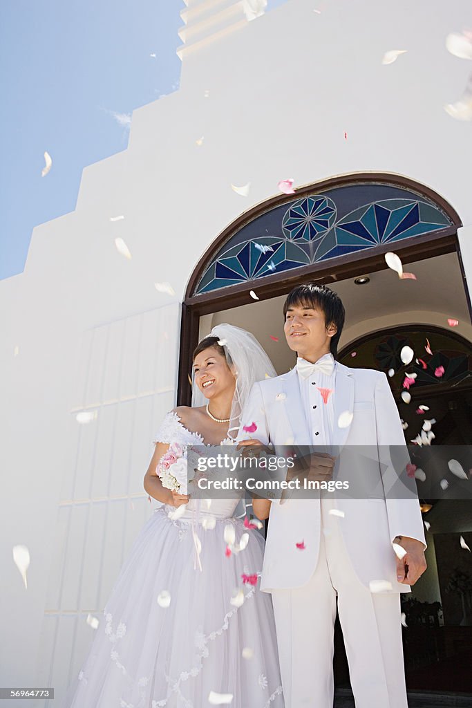 Confetti showering upon newlyweds