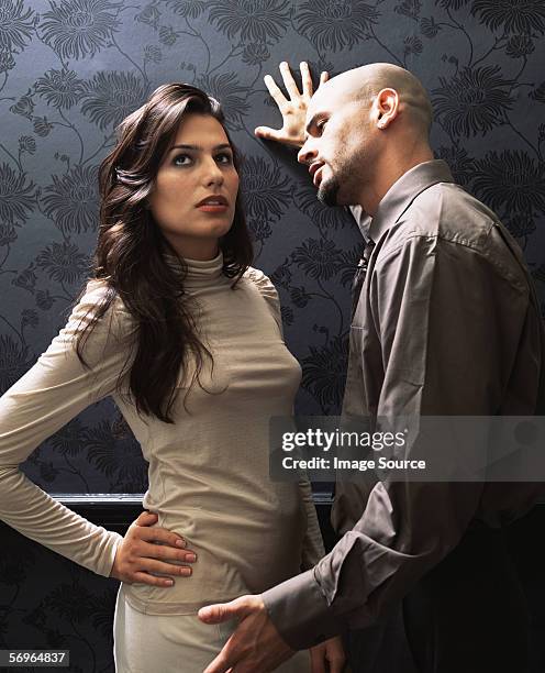 man pleading with beautiful woman - needy girlfriend stock pictures, royalty-free photos & images