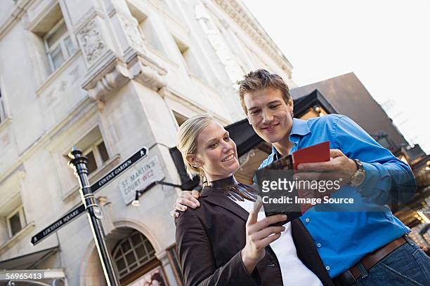 couple in west end of london - leicester square theatre stock pictures, royalty-free photos & images