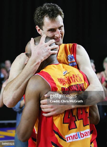 Chris Anstey of the Tigers and team mate Darryl McDonald embrace as they celebrate victory over the Kings and claiming the NBL title after game three...