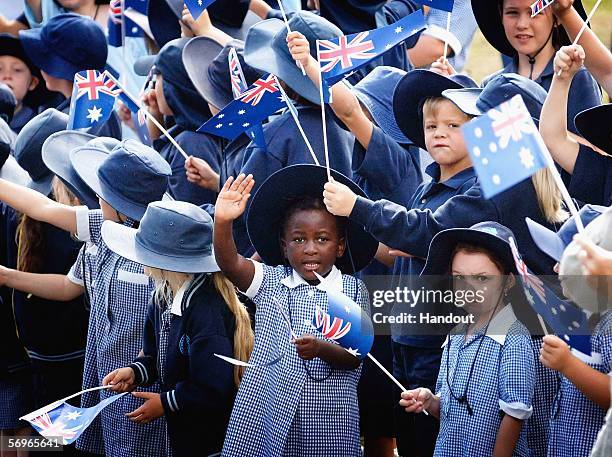 School children wait for the Melbourne 2006 Queen's Baton during its journey from Bombala To Traralgon as part of the Melbourne 2006 Commonwealth...