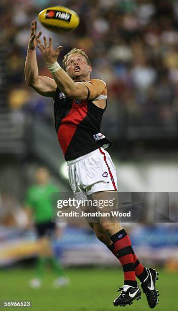 Mark Johnson of the Bombers takes a mark during the first round NAB Cup match between the Brisbane Lions and Essendon at Carrara Stadium on February...