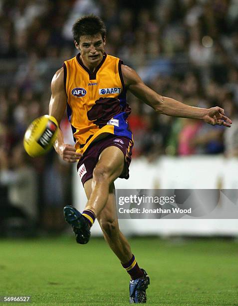 Jayden Attard of the Lions kicks the ball forward during the first round NAB Cup match between the Brisbane Lions and Essendon at Carrara Stadium on...