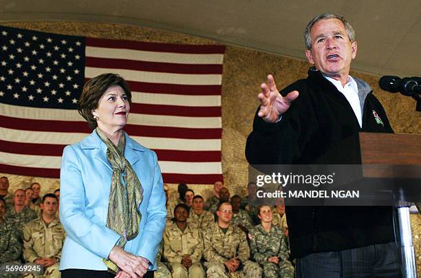 Bagram Air Base, AFGHANISTAN: US President George W. Bush speaks to US and coalition troops 01 March 2006 as First Lady Laura Bush looks on at Bagram...