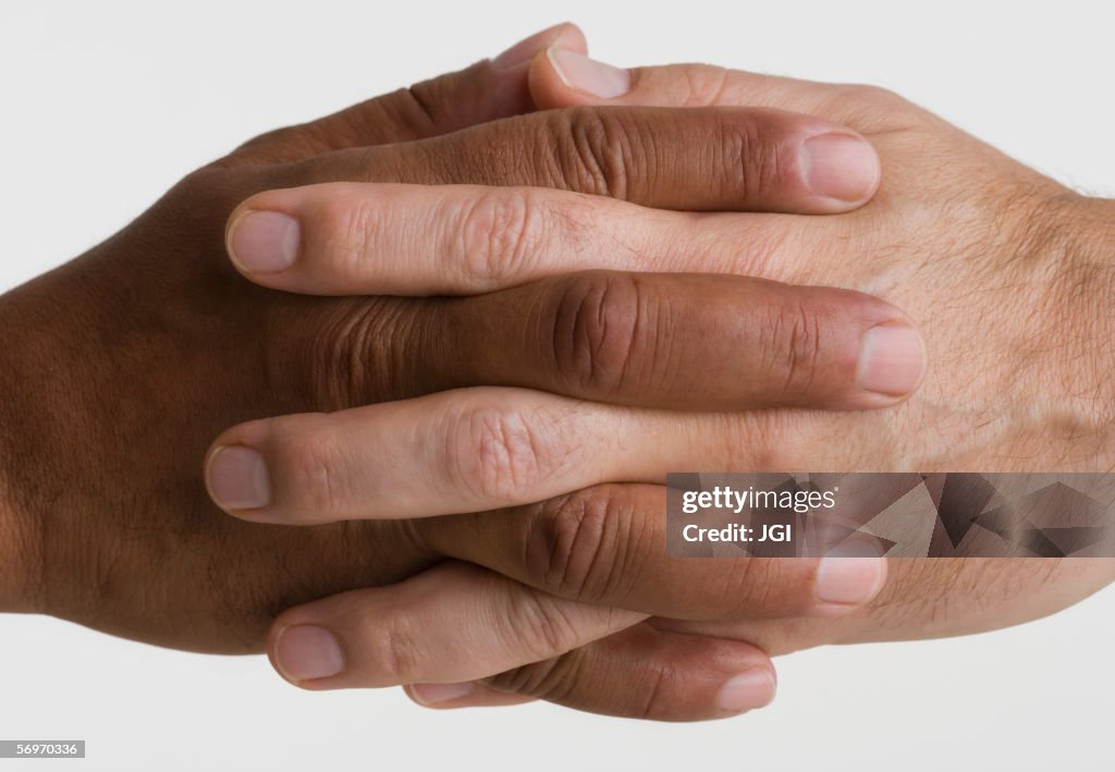 Close up of two hands interlocking