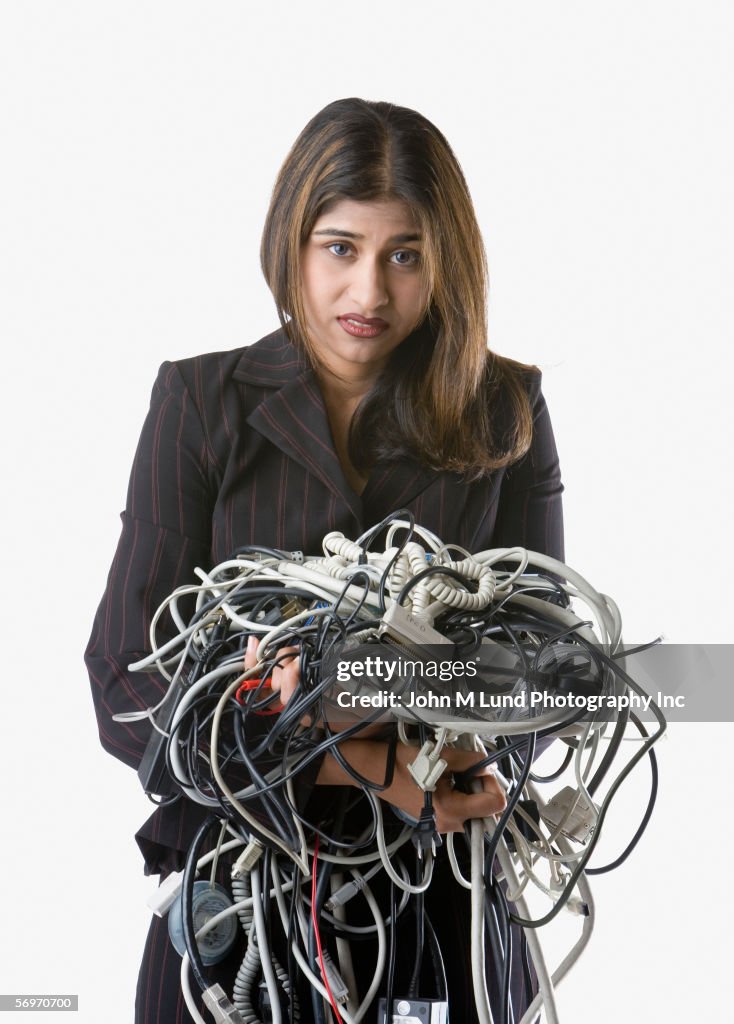 Tangled Computer Management Businesswoman Holding Tangled Computer Cords High-Res Stock Photo ...