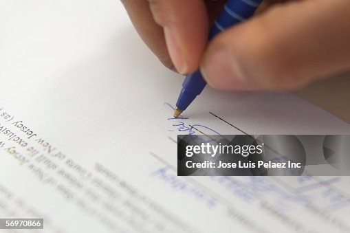 Signing Hand Example Close Up Of Hand Signing Document High-Res Stock Photo - Getty Images