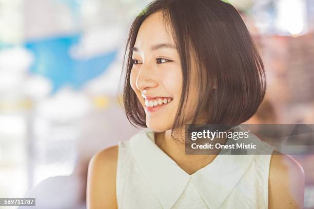 young asian woman relax at cafe - beautiful chinese girls stock pictures, royalty-free photos & images