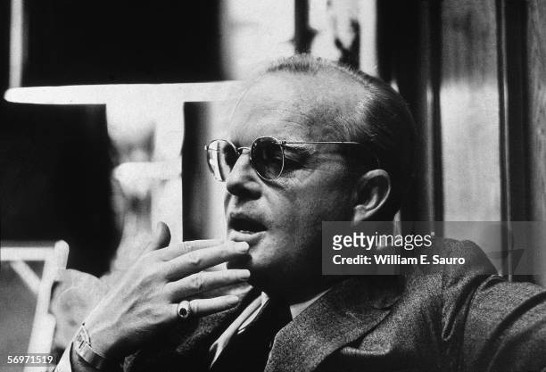 American novelist, short story writer, and playwright Truman Capote contemplatively touches his fingers to his chin during an interview at the Random...