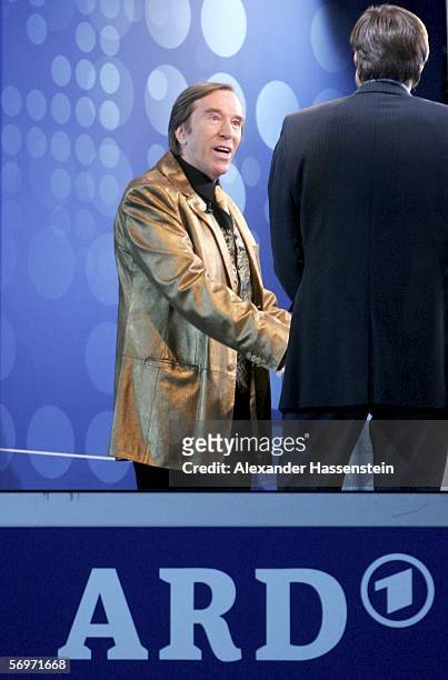 Moderator Guenter Netzer seen in the golden jacket of TV presenter Thomas Gottschalk during the international friendly match between Italy and...