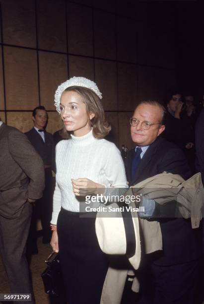 American novelist, short story writer, and playwright Truman Capote escorts American socialite, actress and public relations executive Princess Lee...