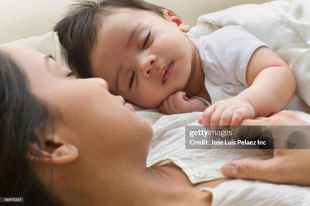 Mother and baby sleeping together