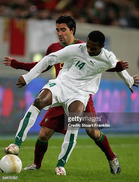 Saud Ali M Khariri of Saudi Arabia challenges for the ball with Deco of Portugal during the international friendly match between Saudi Arabia and...