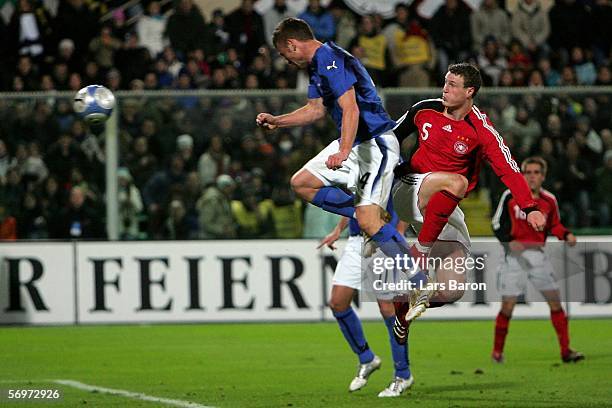 Daniele de Rossi of Italy scores the third goal against Robert Huth of Germany during the international friendly match between Italy and Germany at...
