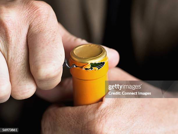 opening wine bottle - corkscrew stock pictures, royalty-free photos & images