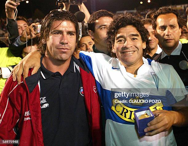 Argentine football legend Diego Armando Maradona poses with Chilean player Marcelo Salas during a visit to Santiago, 01 March 2006. Maradona arrived...