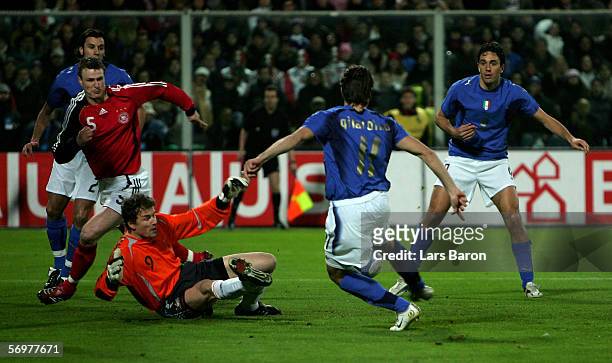 Alberto Gilardino of Italy scores the first goal past Jens Lehmann of Germany during the international friendly match between Italy and Germany at...