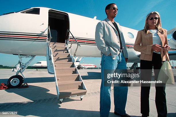 Tiger Woods and his girlfriend Joanna Jagoda are seen arriving at Hamburg International airport on May 16, 2000 in Hamburg, Germany.