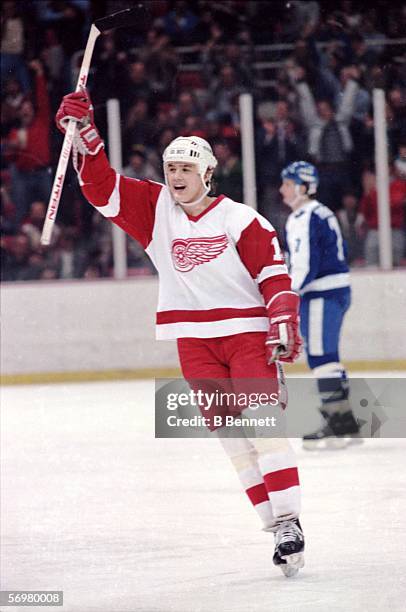 Canadian hockey player Steve Yzerman of the Detroit Red Wings celebrates a goal during a game against the Toronto Maple Leafs, Detroit, Michigan,...