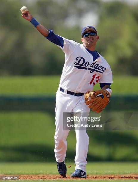 Oscar Robles of the Los Angeles Dodgers throws the ball to first base during the Major League Baseball spring training game against the Atlanta...