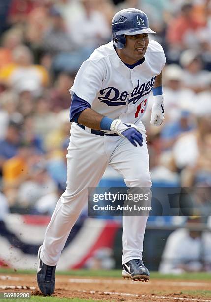 Oscar Robles of the Los Angeles Dodgers runs to first base during the Major League Baseball spring training game against the Atlanta Braves on March...