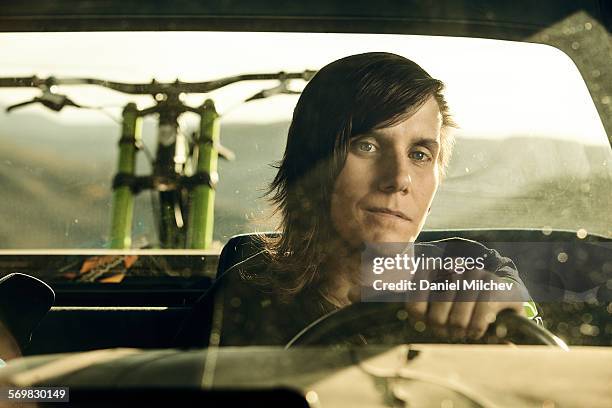 cinematic portrait of a female mountain biker. - female driving stock pictures, royalty-free photos & images