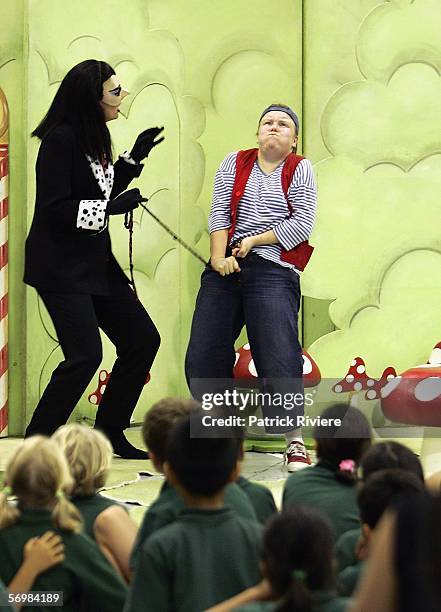 Singers Jane Parkin playing the role of the Witch and Louise Watts playing the role of Hansel perform in front of children from the Crown Street...