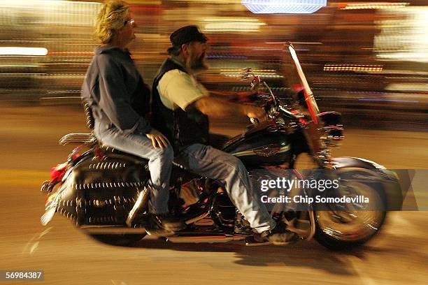 Motorcycle riders and enthusiasts take to the streets the night before the official kick off of Bike Week March 2, 2006 in Daytona Beach, FL. More...