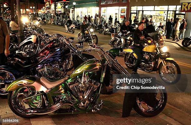 Motorcycle riders and enthusiasts take to the streets the night before the official kick off of Bike Week March 2, 2006 in Daytona Beach, FL. More...