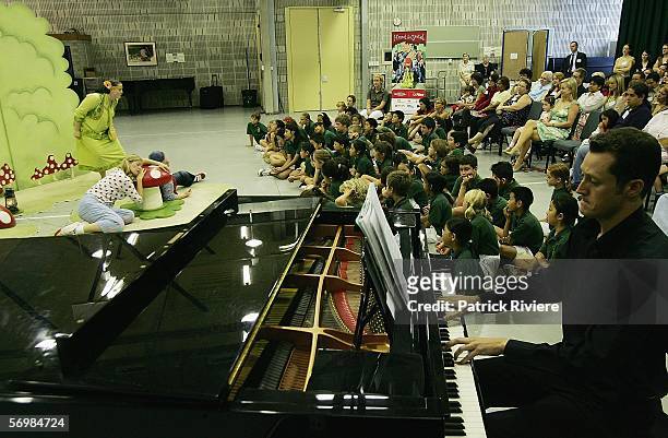 Pianist Heinz Schweers performs in front of the Crown Street Primary school children during the OzOpera tour launch for Humperdinck's "Hansel and...