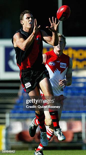 Matthew Lloyd of the Bombers marks during the NAB Challenge match between the Essendon Bombers and Sydney Swans at Optus Oval March 03, 2006 in...