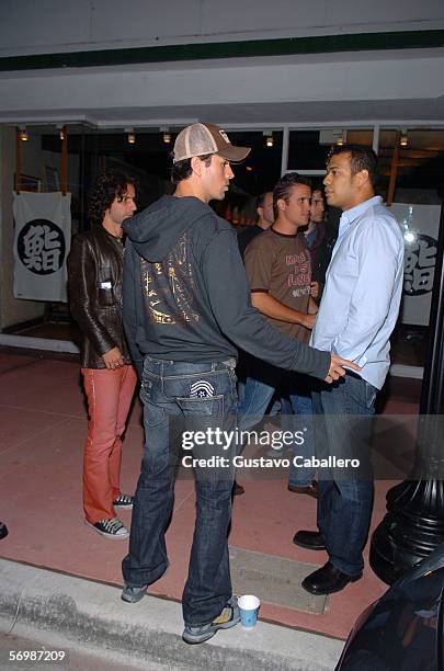 Enrique Iglesias leaves a Miami Beach restaurant after a late night meeting with singer Paulina Rubio on March 3, 2006 in Miami Beach, Florida.