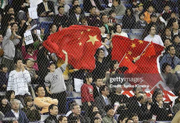 Fans of China cheer while waiving the Chinese flag during the first round of the 2006 World Baseball Classic at the Tokyo Dome on March 3, 2006 in...