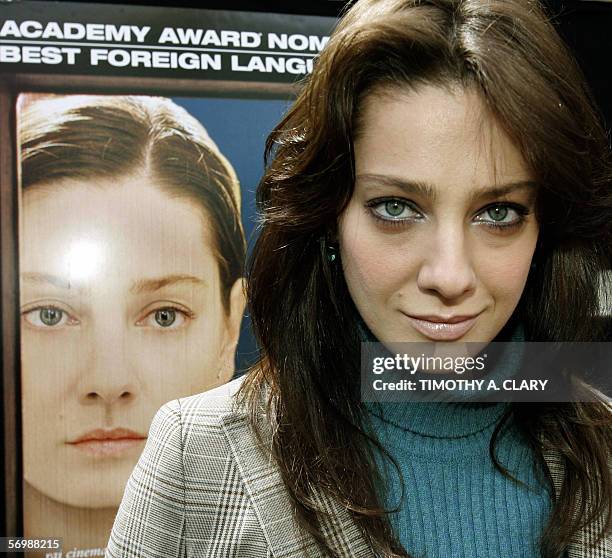 Los Angeles, UNITED STATES: Italian movie star Giovanna Mezzogiorno poses next to a poster from the nominated film she is in titled "Don't Tell"...