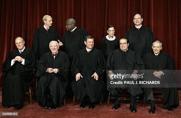Washington, UNITED STATES: Justices of the US Supreme Court pose for their class photo 03 March 2006 inside the Supreme Court in Washington, DC....