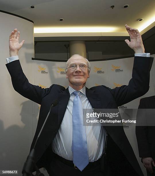 Newly elected Liberal Democrat party leader Sir Menzies Campbell triumphantly greets party members as he arrives for the liberal Democratic Party...