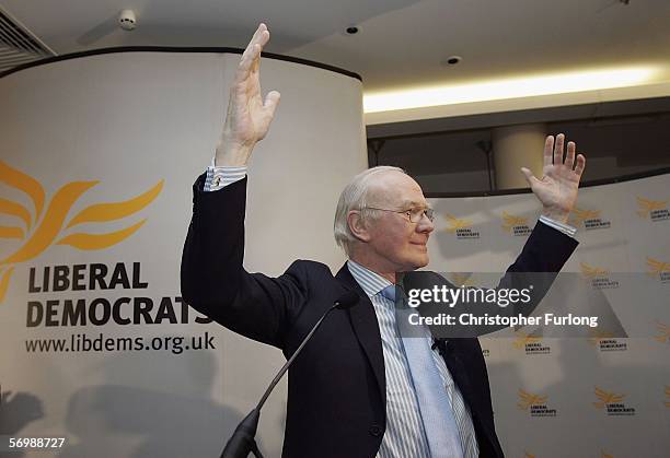 Newly elected Liberal Democrat party leader Sir Menzies Campbell triumphantly greets party members as he arrives for the liberal Democratic Party...