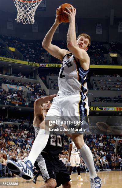 Jake Tsakalidis of the Memphis Grizzlies pulls down a rebound during a game between the San Antonio Spurs and the Memphis Grizzlies on February 24,...