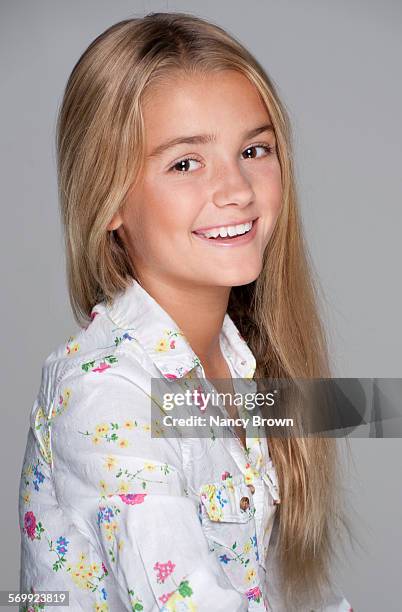 eleven year old girl head shot smiling - brown eyes stock pictures, royalty-free photos & images