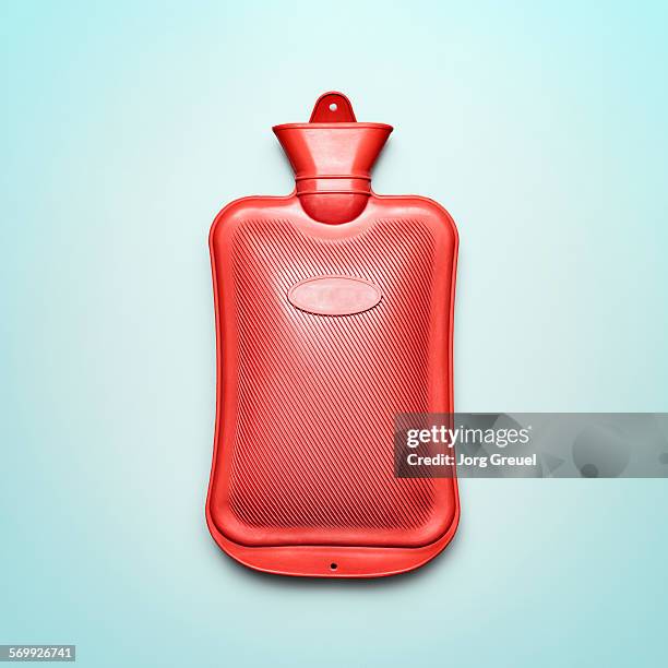 hot water bottle made from rubber - wärmflasche stock-fotos und bilder
