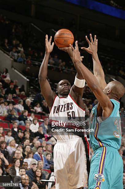Zach Randolph of the Portland Trail Blazers reaches for the ball against David West of the New Orleans/Oklahoma City Hornets February 26, 2006 at the...