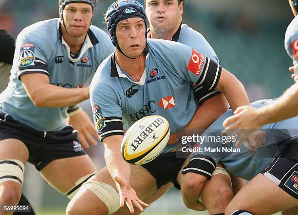 Dan Vickerman of the Waratahs offloads from a line out during the round four Super 14 match between the NSW Waratahs and the Sharks played at Aussie...