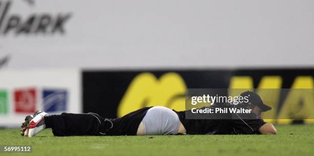 Lou Vincent of New Zealand looses his trousers after attempting a catch during the fifth one day international match between New Zealand and the West...