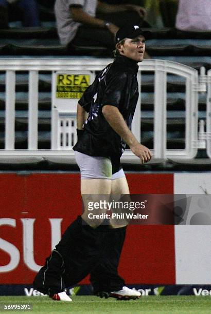 Lou Vincent of New Zealand looses his trousers as he fields during the fifth one day international match between New Zealand and the West Indies at...
