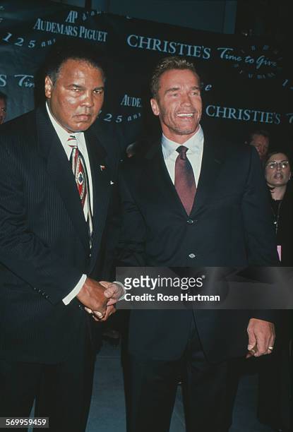 American former boxer, Muhammad Ali, and Austrian-American actor, Arnold Schwarzenegger, attending the Audemars Piguet 125th Anniversary event at...