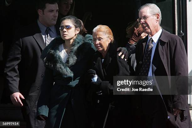 Alejandra St. Guillen and her mother Maureen St. Guillen exit with family and friends from the Gormley Funeral Home after attending the funeral...